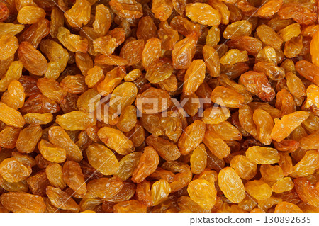 Yellow Raisins as a background. Top view. Flat lay Yellow Raisins as a background. Top view. Flat lay 130892635