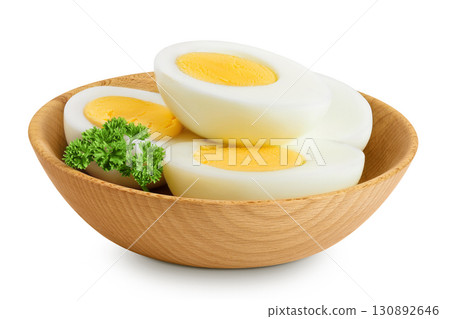 Boiled chicken egg in wooden bowl isolated on white background. Boiled chicken egg in wooden bowl isolated on white background. 130892646