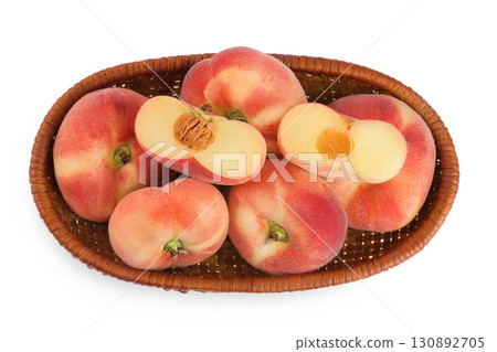 chinese flat donut peaches in a wicker basket isolated on white background. Top view. Flat lay chinese flat donut peaches in a wicker basket isolated on white background. Top view. Flat lay 130892705