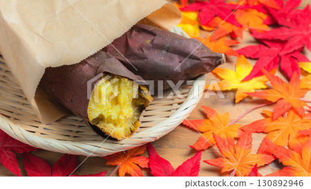 Autumn leaves and baked sweet potatoes (Silk Sweet) in a paper bag Autumn leaves and baked sweet potatoes (Silk Sweet) in a paper bag 130892946