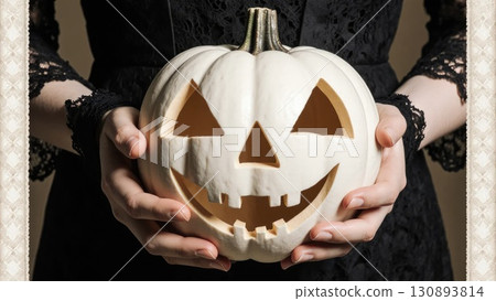 Elegant Hands in Black Lace Holding White Victorian Jack-o-Lantern Elegant Hands in Black Lace Holding White Victorian Jack-o-Lantern 130893814