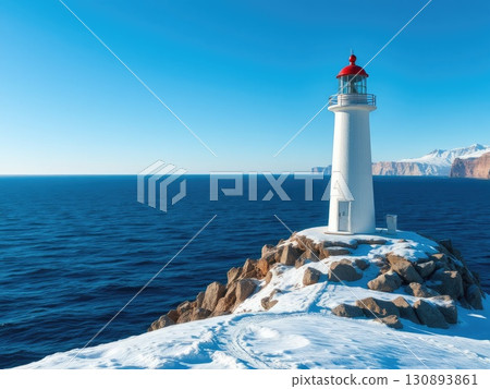 Snowy Coastal Lighthouse on a Winter Day 130893861