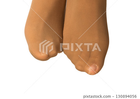 female legs in torn tights on white background, close-up 130894056