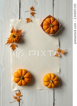 Natural pumpkins and leaves on bright wooden festive background 130895195