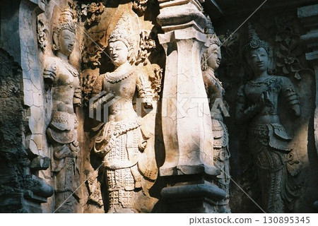 Stone statues at Angkor Wat illuminated by oblique light Stone statues at Angkor Wat illuminated by oblique light 130895345
