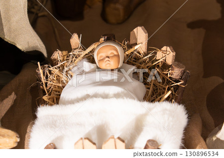 Baby Jesus laying in a cradle Baby Jesus laying in a cradle 130896534