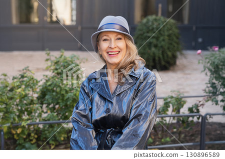 Attractive grey-haired woman in her sixties in a blue jacket Attractive grey-haired woman in her sixties in a blue jacket 130896589
