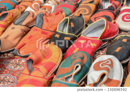 Colorful Slippers at the sale counter in souvenir market 130896592