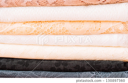 Close up of lace textures in layers, pastel colors Close up of lace textures in layers, pastel colors 130897360