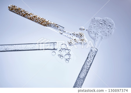 Three test tubes with spilled serums. Demonstration of textures. 130897374