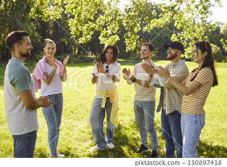 Happy Friends Playing Game At Park Party 130897418