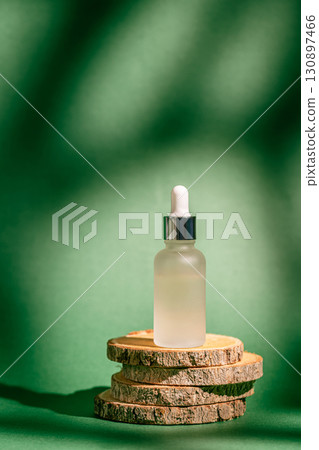 A frosted dropper bottle of facial serum A frosted dropper bottle of facial serum 130897466