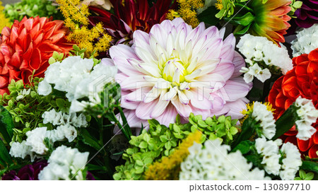 Colorful autumn flower arrangement perfect for fall weddings and thanksgiving celebrations 130897710