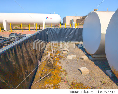 Inside temporary plastic lined secondary containment for fuel storage tanks 130897748