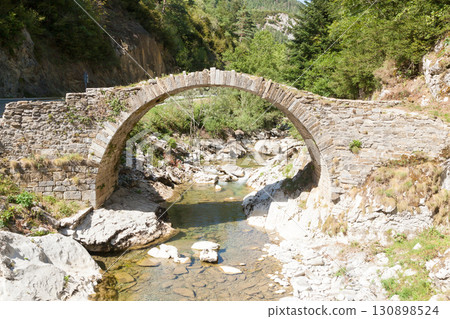 Ancient Roman bridge along the road to Anso, Spain. Ordesa valley 130898524