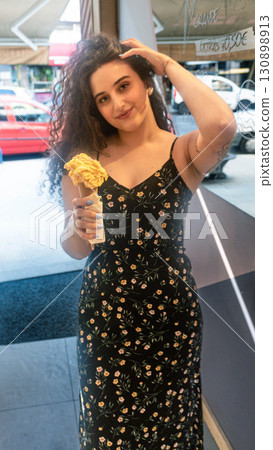 Woman with Melting Ice Cream 130898913