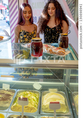 Women and ice cream in summer Women and ice cream in summer 130898941