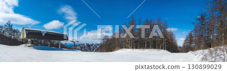 Panoramic view of snow-capped mountains and slopes from the summit lift station (Tomi City, Nagano Prefecture, Tsumagoi Village, Gunma Prefecture, Yunomaru Plateau) 130899029