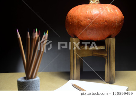 Pumpkin and sketchbook for autumn images Pumpkin and sketchbook for autumn images 130899499