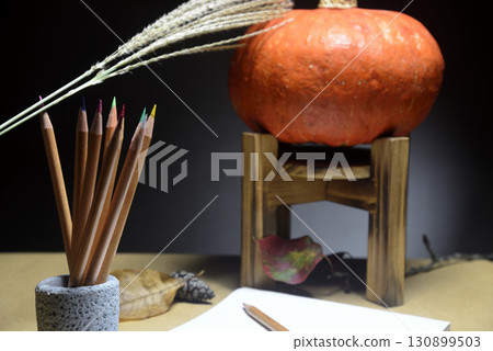 Pumpkin and sketchbook for autumn images Pumpkin and sketchbook for autumn images 130899503