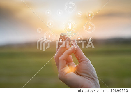 Holding technology in nature under the golden sunset glow. Holding technology in nature under the golden sunset glow. 130899510