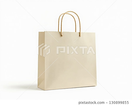 Simple kraft paper bag with twisted handles for shopping or gifting displayed against a minimalist background 130899855
