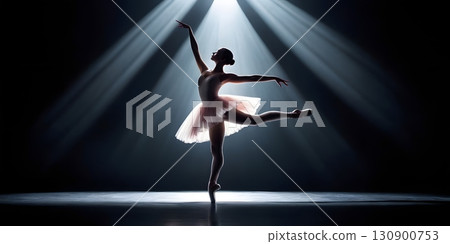 Silhouette of ballerina in graceful dance pose with glowing spotlight, cinematic elegant stage scene 130900753