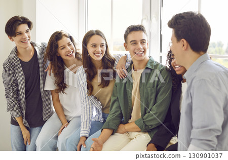 Diverse Group of Teenage Students Talking in Classroom Diverse Group of Teenage Students Talking in Classroom 130901037