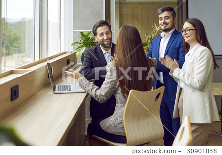 Happy business people talking in office at the workplace making successful deal. Happy business people talking in office at the workplace making successful deal. 130901038