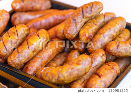 A tray of charcoal-grilled sausages A tray of charcoal-grilled sausages 130901235