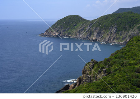 Steep mountain cliff and a national flag, and the South China Sea to the horizon in Vietnam 130901420