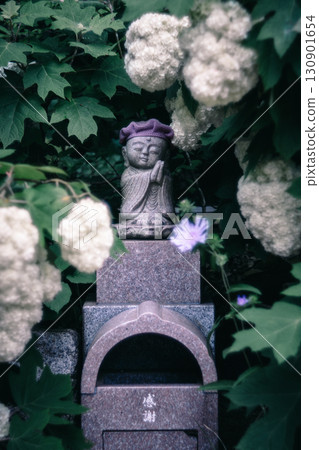 Jizo surrounded by hydrangeas 130901654