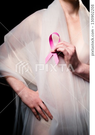 Woman Wearing White Dress And Pink Ribbon For Cancer Awareness  130902208