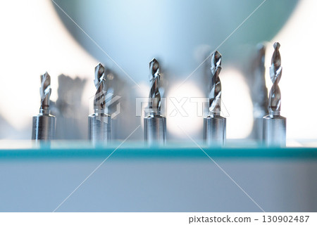 Full set of dental implant drill bits in surgical tray, close-up of professional dentistry equipment 130902487