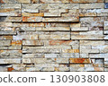 Image of a natural stone brick wall 130903808