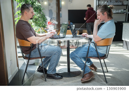 Business project team working together at meeting room at office. Programmers working in the office of a software development company. Coding technologies, site design 130903900