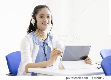 Girl learning tablet 130904209