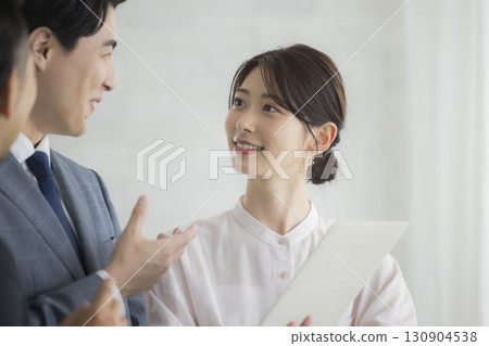 Businessman and businesswoman with laptop 130904538
