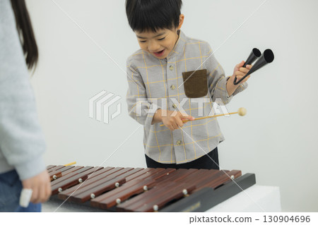 Child playing xylophone Child playing xylophone 130904696