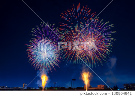 A night view of a fireworks display where colorful fireworks light up the night sky 130904941
