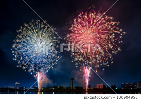 A night view of a fireworks display where colorful fireworks light up the night sky 130904953