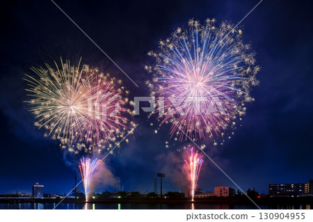 A night view of a fireworks display where colorful fireworks light up the night sky A night view of a fireworks display where colorful fireworks light up the night sky 130904955