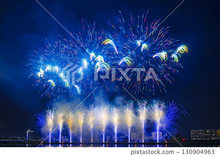 A night view of a fireworks display where colorful fireworks light up the night sky 130904963