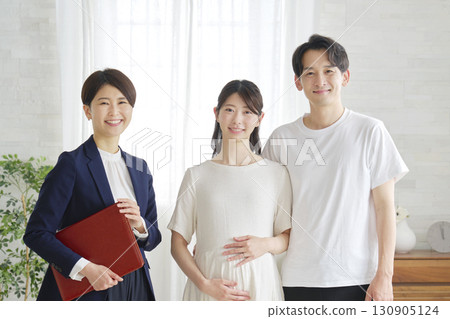 A couple in their 20s and a financial planner, portrait, looking at the camera A couple in their 20s and a financial planner, portrait, looking at the camera 130905124