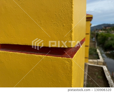 Architectural detail of colorful building exterior with geometric form 130906320
