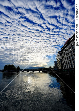 Geneva's Lake Geneva and sky of cirrocumulus clouds. Beautiful nature and spectacular Swiss scenery. Geneva's Lake Geneva and sky of cirrocumulus clouds. Beautiful nature and spectacular Swiss scenery. 130906444