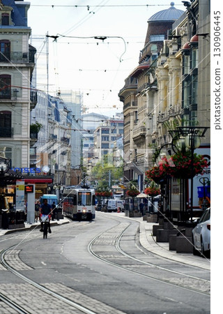 Blue tram running through the city of Zurich and beautiful cityscape. Spectacular scenery of tourist attractions. 130906445