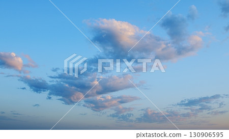 A Beautiful Serene Cloudscape at Dusk with a Soft Blue Sky That Evokes Peacefulness and Calmness 130906595