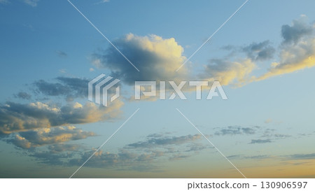 Stunningly Beautiful Cloud Patterns Forming Against a Clear and Vibrant Blue Sky 130906597