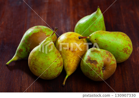 Fresh pears on wooden surface Fresh pears on wooden surface 130907330